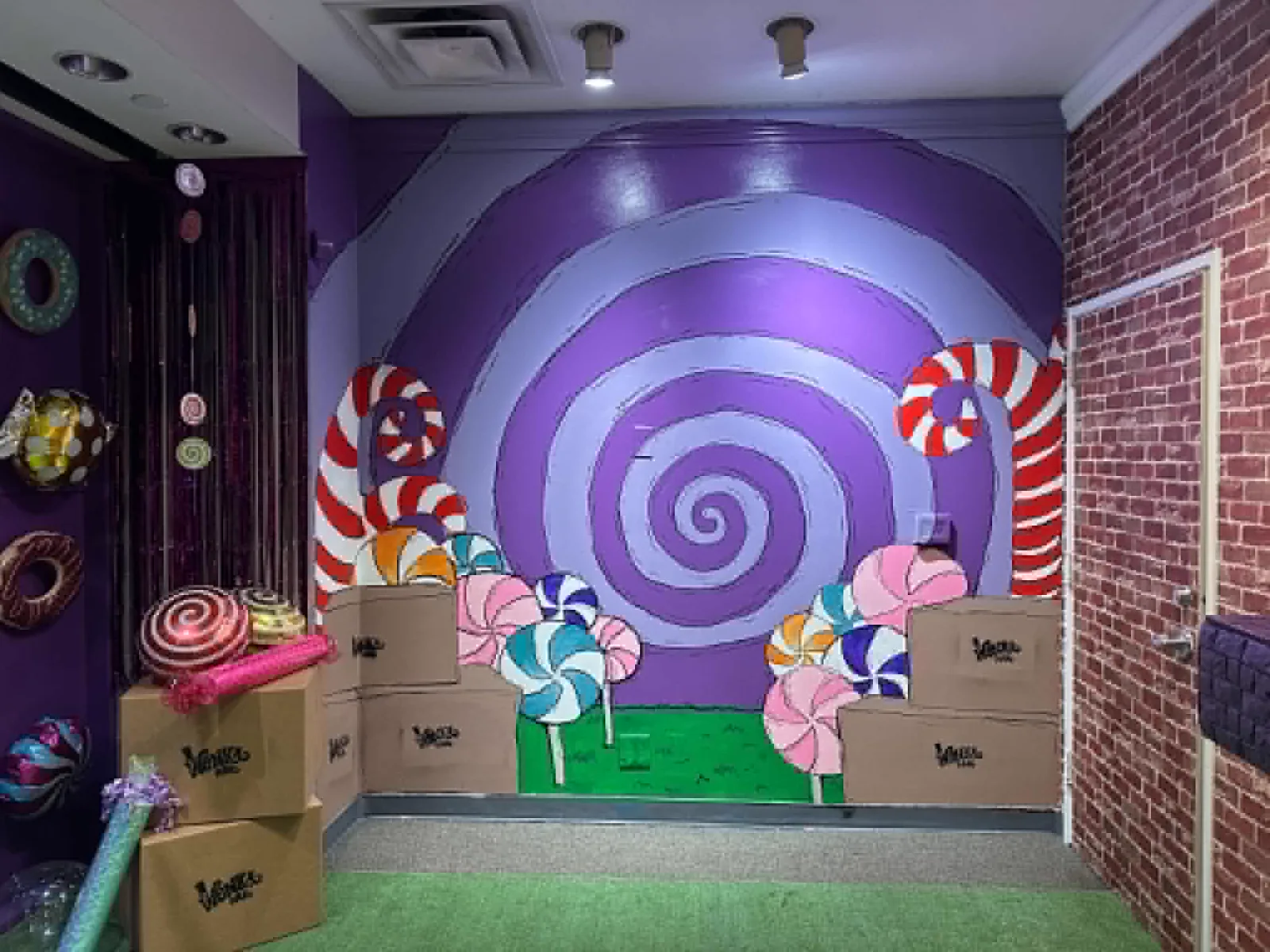 Colorful candy-tunnel mural inside Twisted Escape Rooms during CouveCon